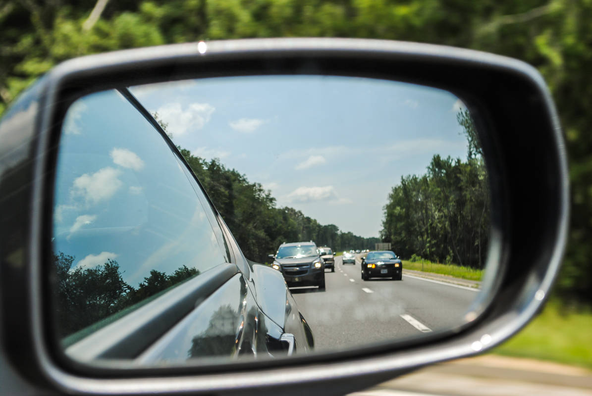 Use side mirrors to check cars behind you
