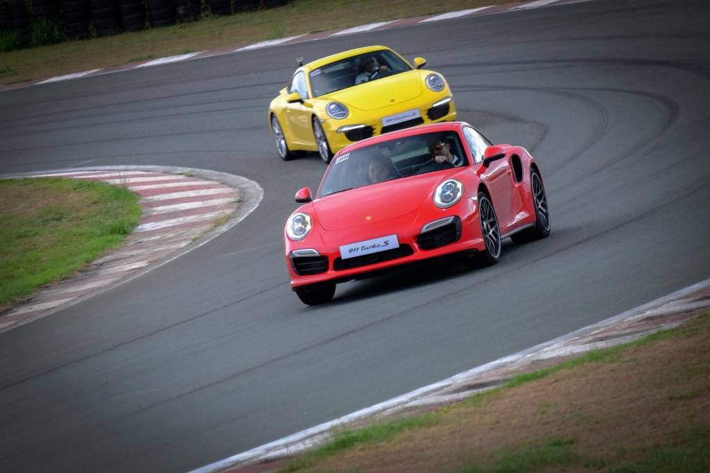 red and yellow Porsche cars