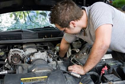 Mechanic fixing an engine