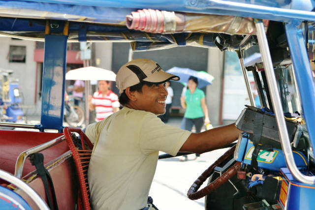 Man in rickshaw