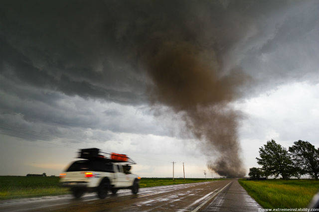 Car chasing tornado