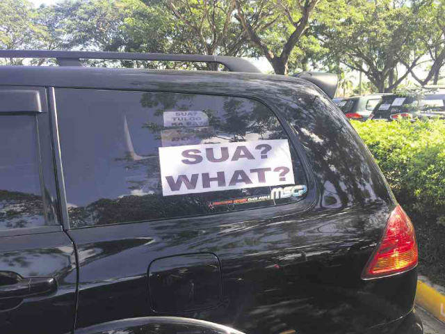 SUA? What? car sign