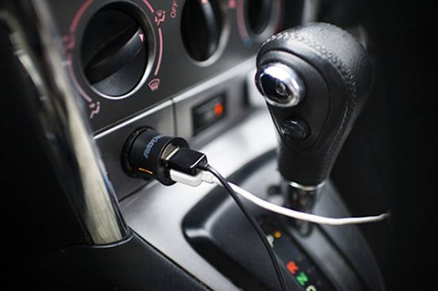 USB plugged into car center console