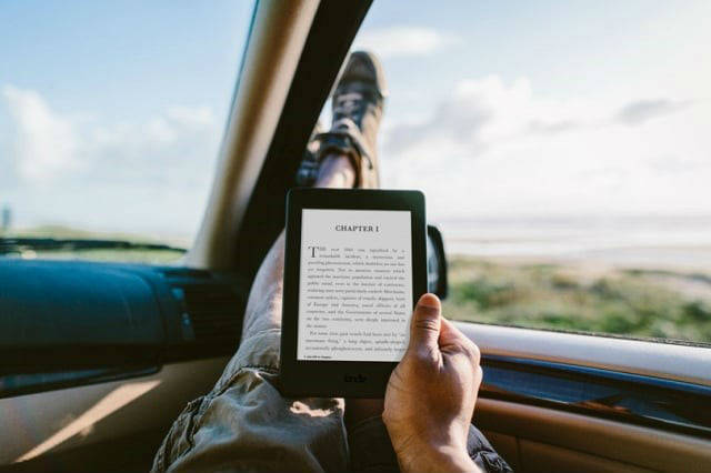 Person reading an e-book in a car