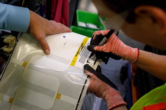 Mark Zuckerberg signing an inspection sticker