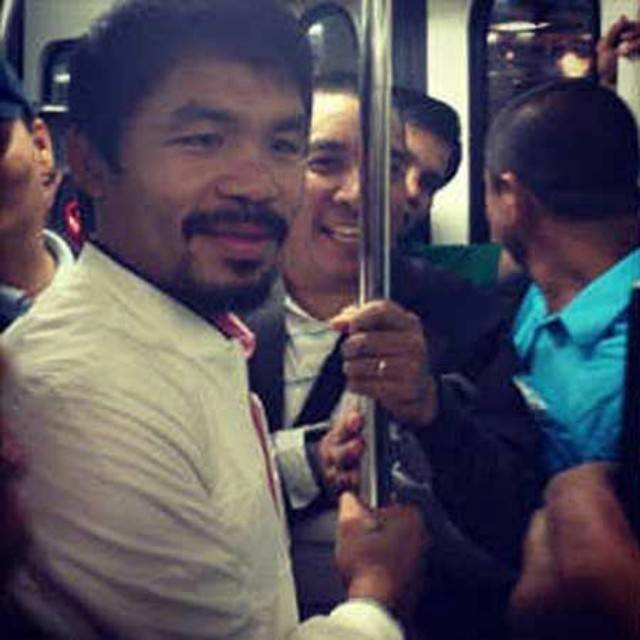 Senator Manny Pacquiao rides the MRT