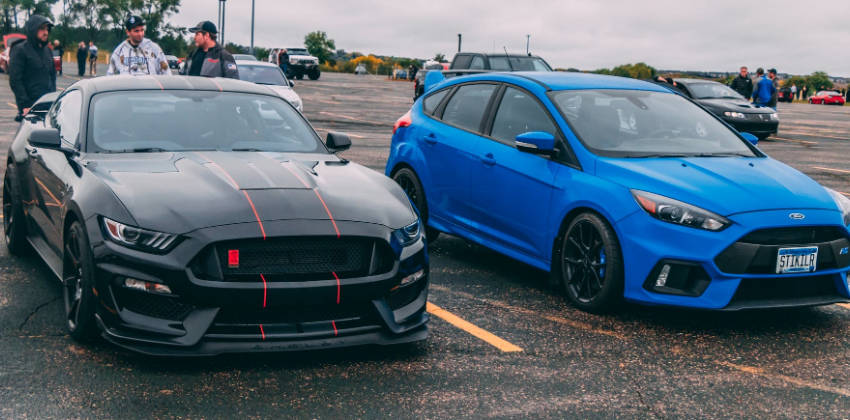 Cars parked in an open parking lot