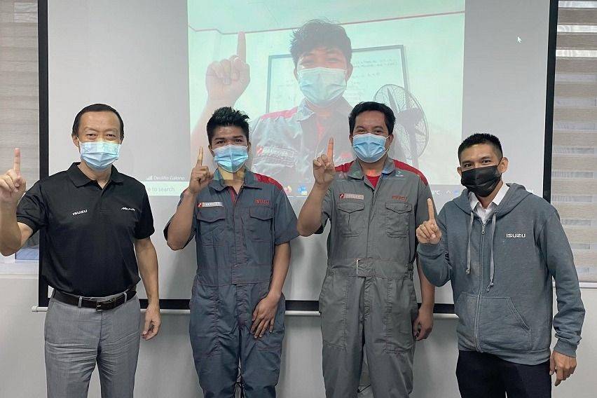 IPC service technicians with company president Hajime Koso