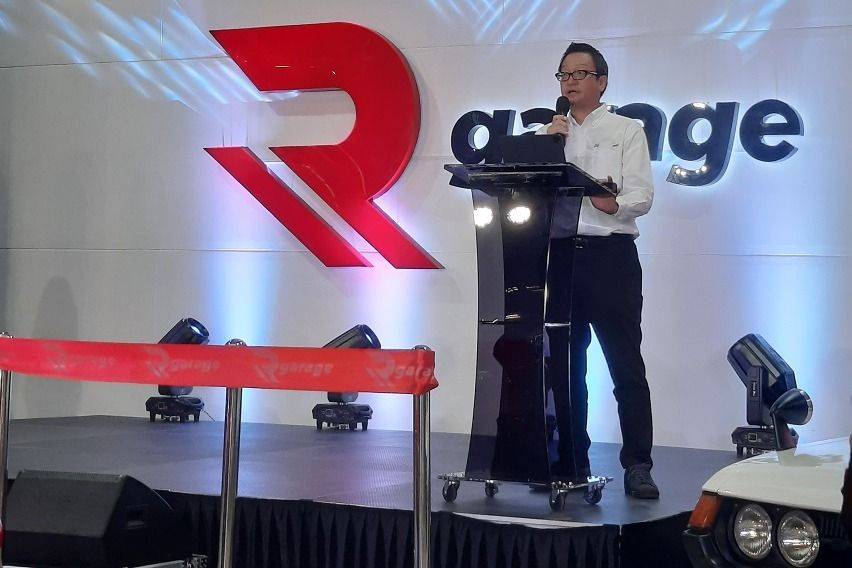 TMP President Atsuhiro Okamoto at the R Garage