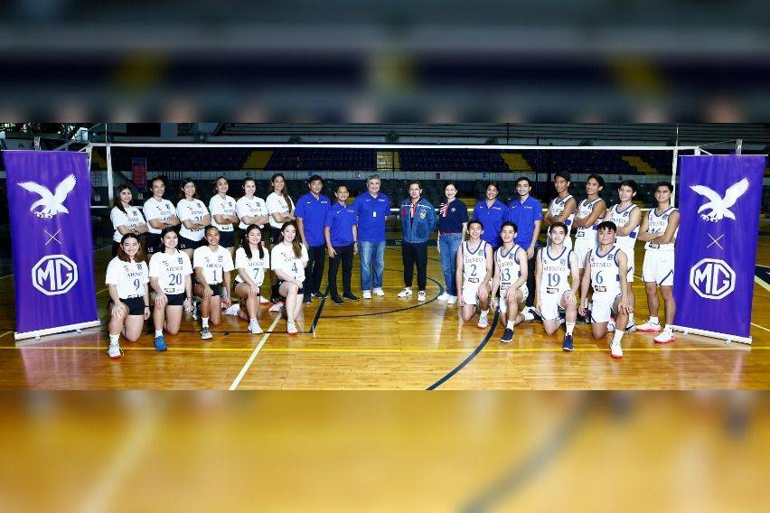 Select players from the Ateneo Blue Eagles Men's and Women's volleyball teams pose with MG Philippines and Ateneo University Athletics executives inside the Ateneo Blue Eagle Gym