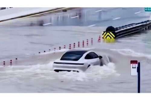 Porsche Taycan EV in Dubai braves flooded street